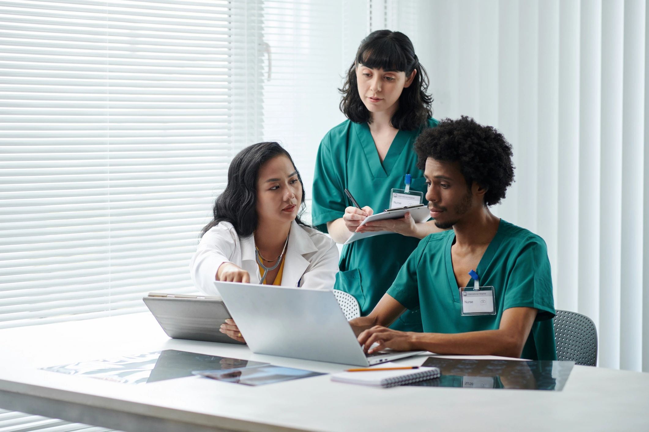 Healthcare team reviewing documents and coordinating care.