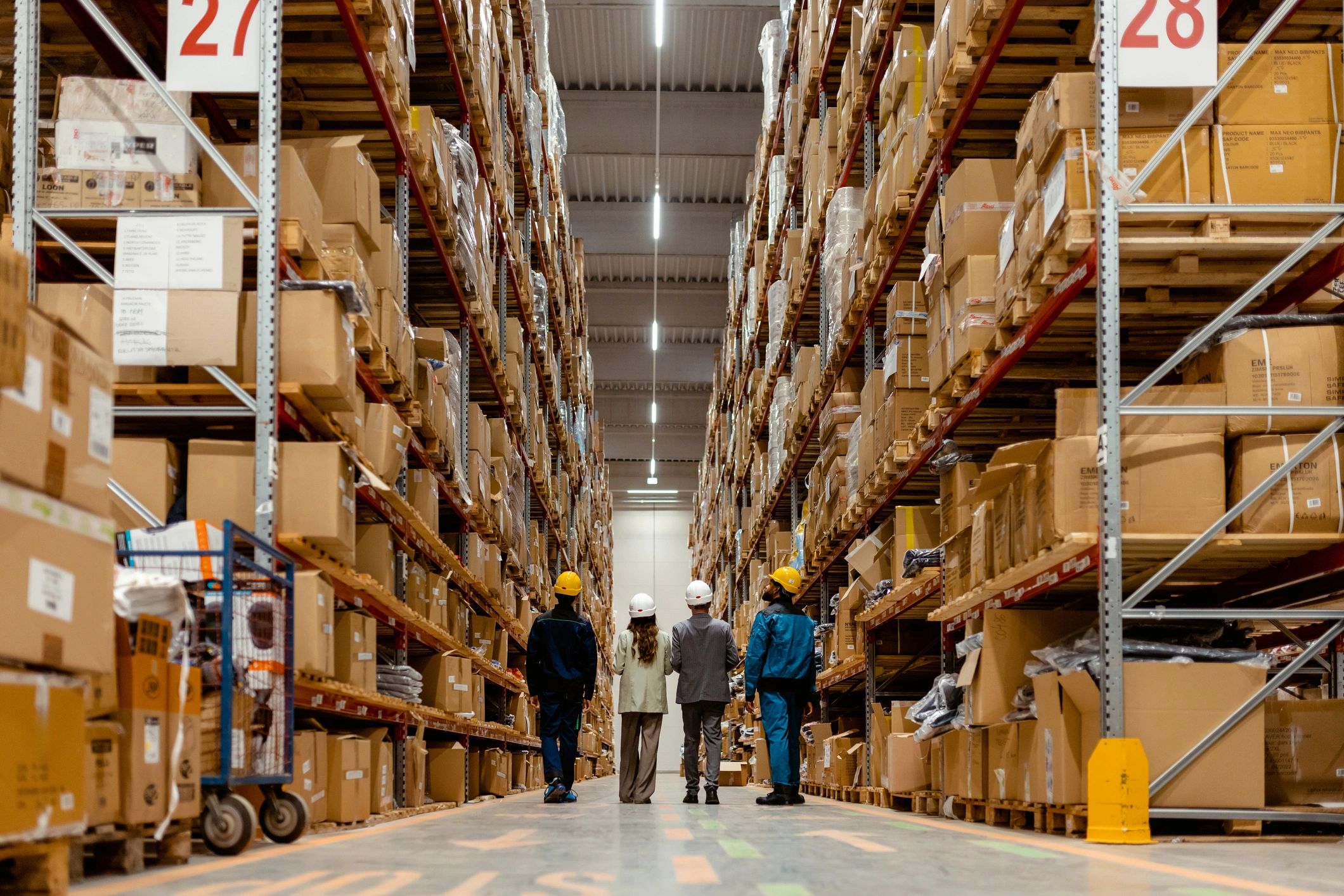 Operations team walking through a warehouse inventory area