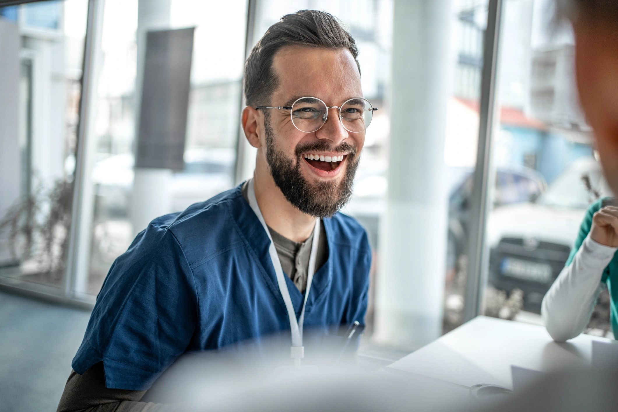 Healthcare professional in a meeting, representing collaborative leadership